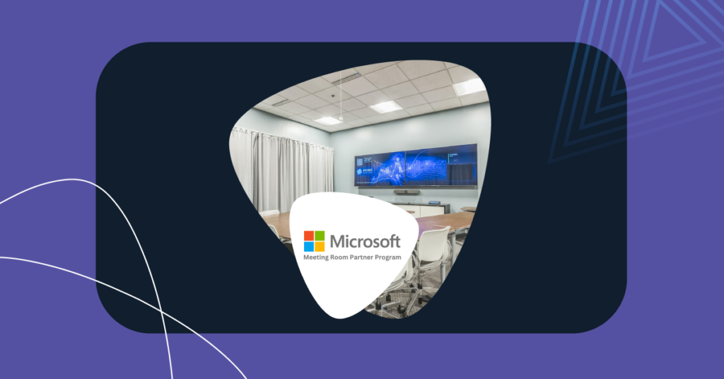 Modern Microsoft Teams Room setup with a dual-display video wall and conference seating.