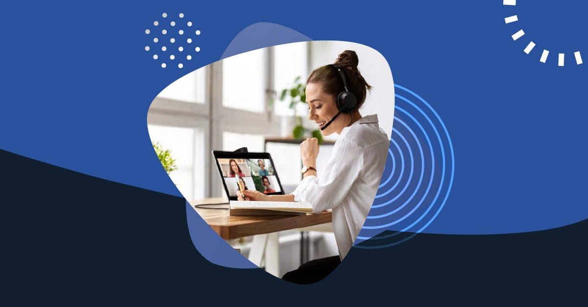 Woman using a headset takes notes during a Microsoft Teams video call on her laptop.