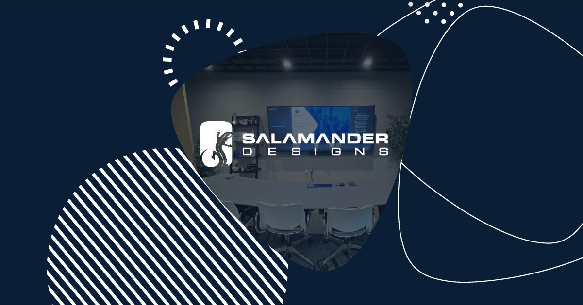 Salamander Designs logo overlaid on a modern conference room setup featuring Microsoft Teams Rooms technology.